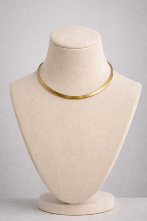 Gold choker necklace close up