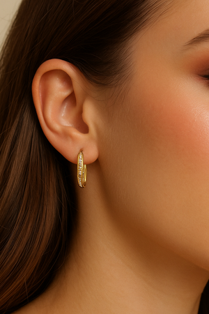 Gold dipped oval hoops with pave CZ stones, on ear