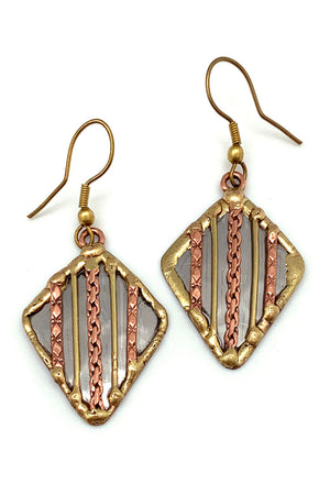 Mixed metal diamond earrings close up