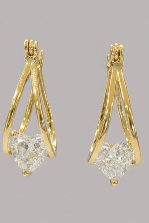 Golden hearthfall teardrop rhinestone earrings, on ear