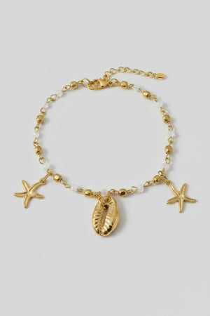 Gold anklet with shell charms close up