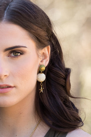 Handmade raffia wood earrings close up