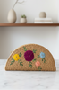 Handmade jute clutch with embroidery detail