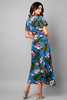 Blue hibiscus floral midi dress in 100% rayon, styled on model