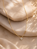 Gold clover pendant chain necklace on model