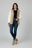 Nylon puffer jacket with cable knit texture styled