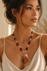 Agate geode centerpiece with pearl and amber necklace