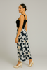Wide-leg floral palazzo pants in black and white, styled on model