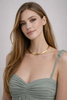 Elegant gold choker detail