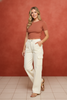 Cream wide-leg pants with cargo pockets