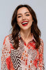 Pink animal print button-down blouse, close-up pattern detail