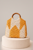 Knotted macrame bag with wooden handle in mustard and cream