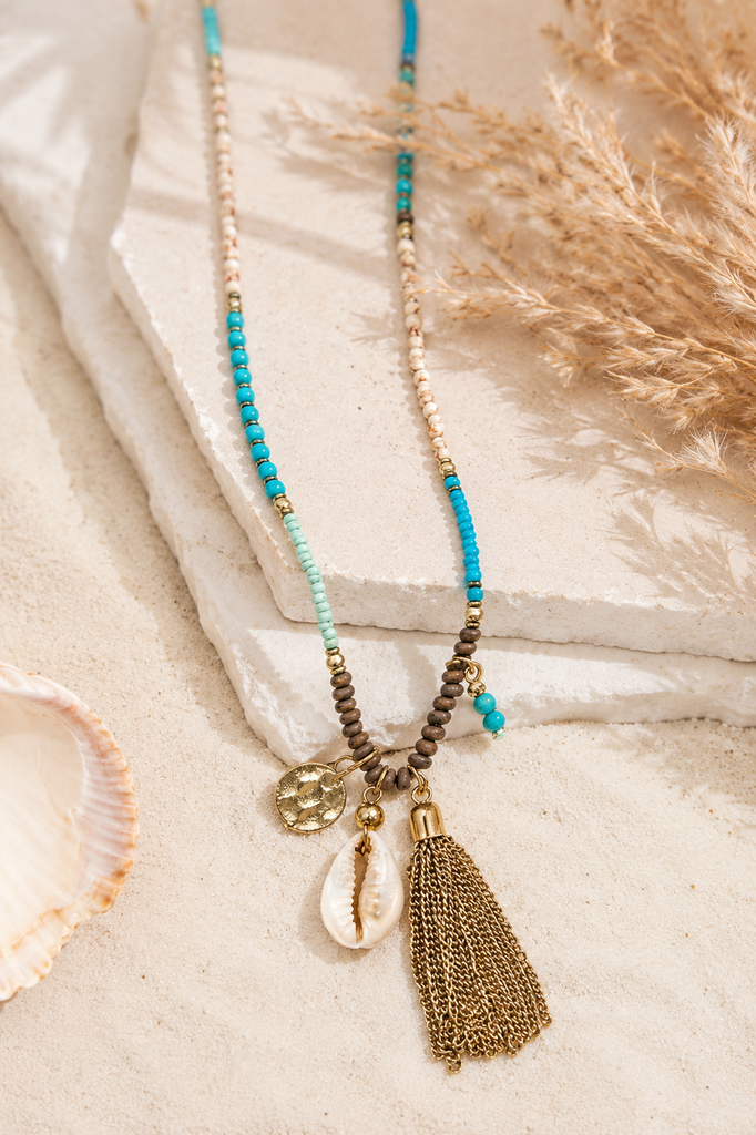 Beachy Boho tassel necklace with beads puka shells and metal disc