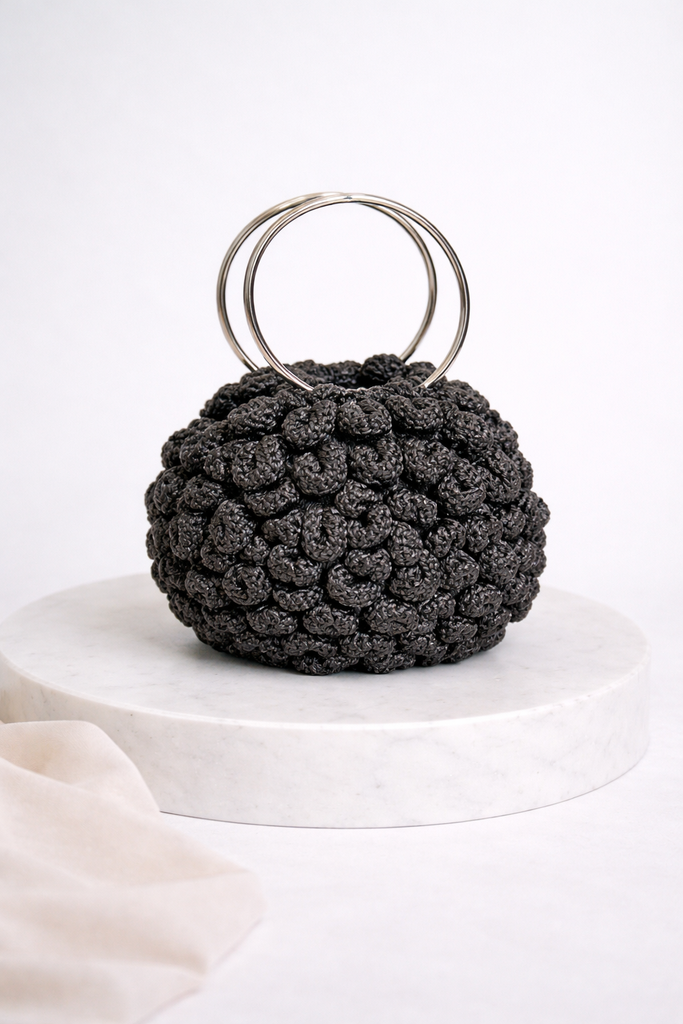 Hand-knitted halo embossed rose bag with steel handles