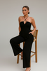 Wide-leg black halter jumpsuit styled look