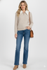 Cable knit zip-up sweater styled