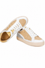 Yellow raffia and faux leather sneaker close up