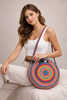 Bohemian round jute tote with bold color detail