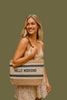 Straw braided tote bag with structured shape, styled view
