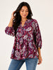 Free spirit paisley flow top with 3/4 sleeves, styled on model