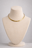 Gold choker necklace close up