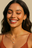 Gold chain pearl charm layered necklace close up