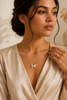 Golden flutter butterfly pendant with CZ pave stones, on neck