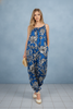 Bali breeze floral jumpsuit with front pockets, styled on model