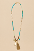 Beads metal disc puka shell tassel necklace detail