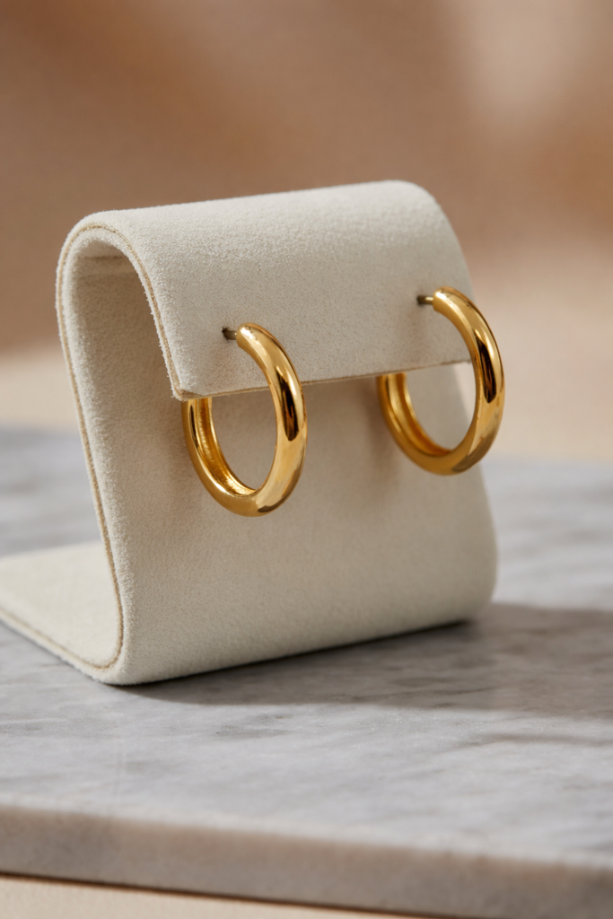 Gold dipped oval hoop earrings, front view
