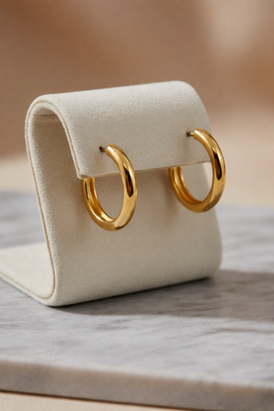 Gold dipped oval hoop earrings, front view