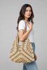 Brown and cream raffia bag styled look