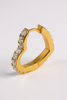 Heart-shaped hinge hoop earrings close up