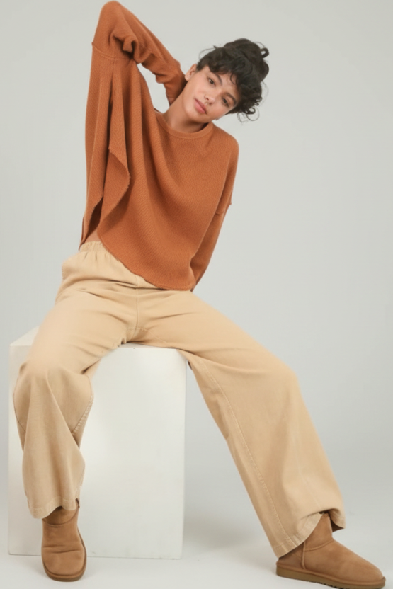 Black elastic-waist pants styled for casual weekend look