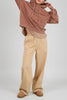Wide-leg black pants styled with tucked blouse