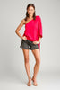 Bold fuchsia one-shoulder waist tie top, styled on model