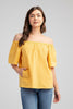 Off-shoulder cotton top styled