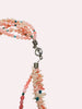 Pink gemstone layered necklace close up