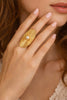 Geometric disc ring with pearl accent