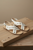 White studded cross band sandals — The Kylie