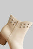 Ivory ankle boot with western stud detail