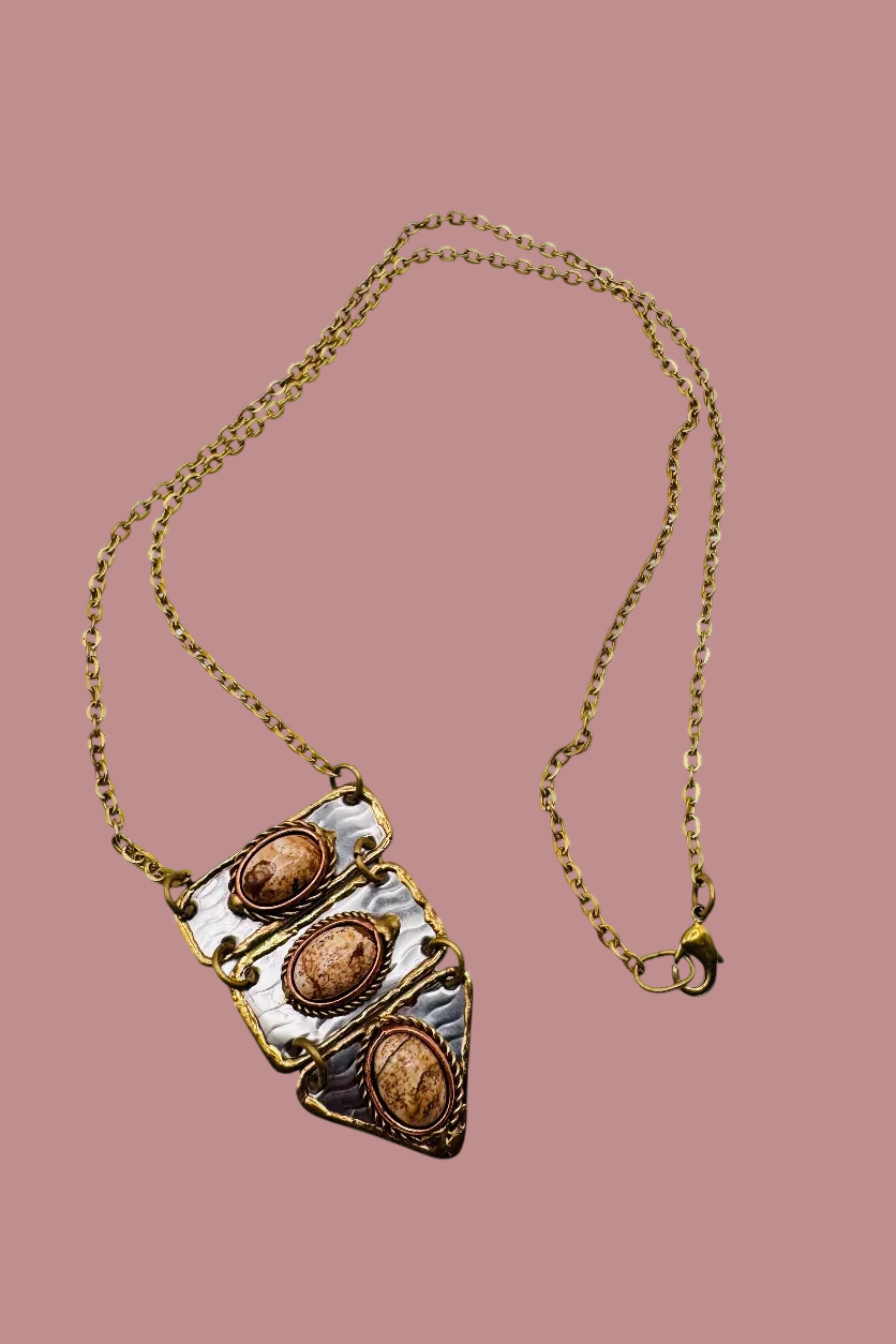 Mixed metal bib necklace accented with Jasper stones.