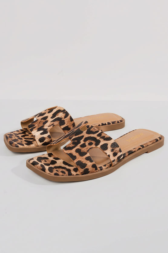 Leopard print slip-on open-toe sandal with X-shaped strap, top view