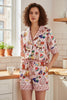 Pink pajama set with playful strawberry trim detail