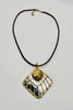 Mixed metal pendant necklace close up