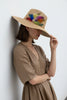 Straw floppy sun hat close up