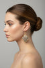 Gold and copper diamond earrings styled