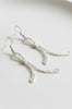 Handmade hammered metal earrings styled