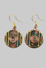 Red green round patina earrings close up