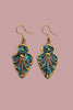 Arrow shaped patina earrings close up